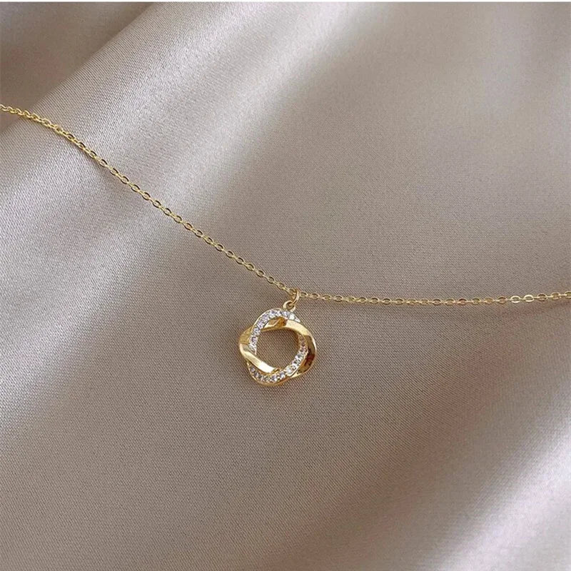 INFINITY - Gold-Plated Crystal Knot Pendant Necklace