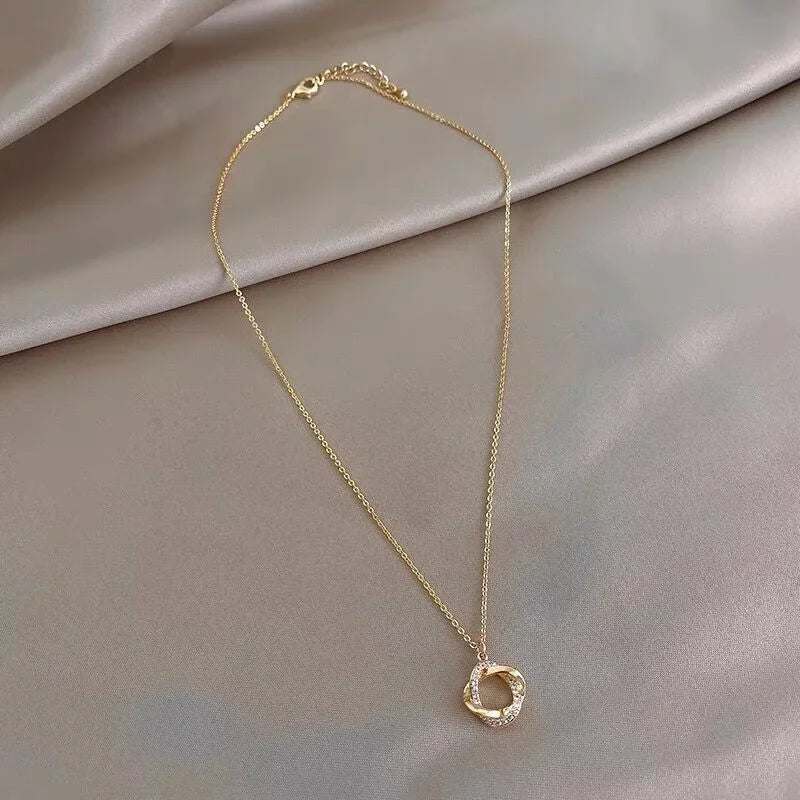 INFINITY - Gold-Plated Crystal Knot Pendant Necklace