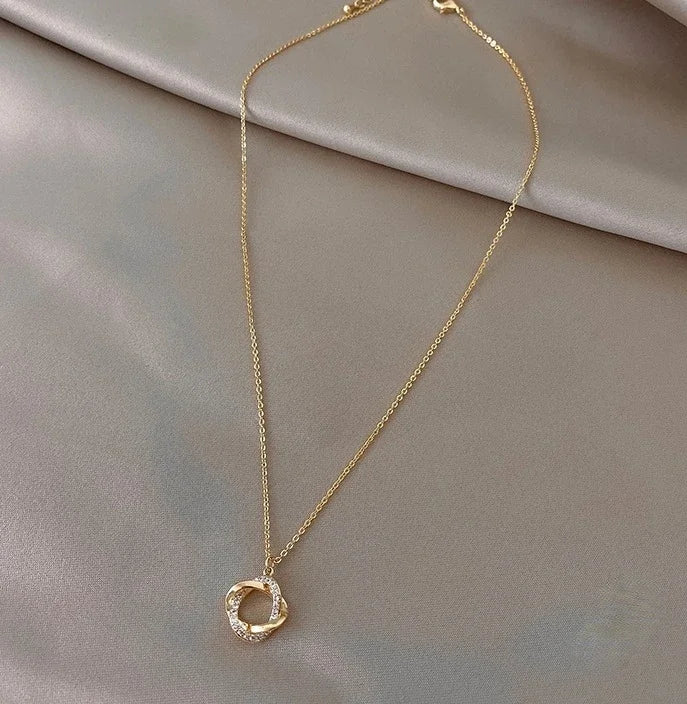 INFINITY - Gold-Plated Crystal Knot Pendant Necklace