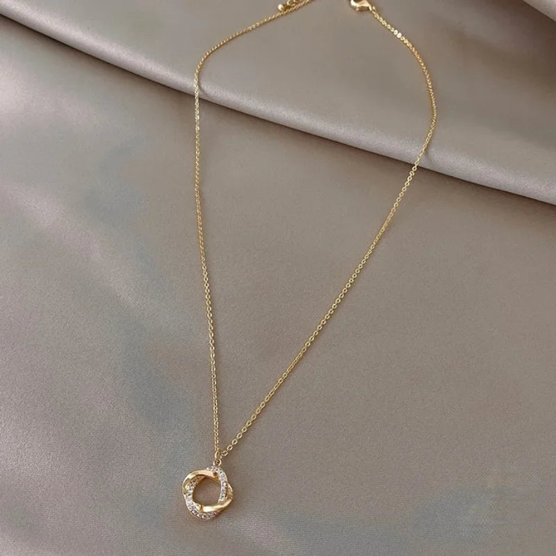 INFINITY - Gold-Plated Crystal Knot Pendant Necklace