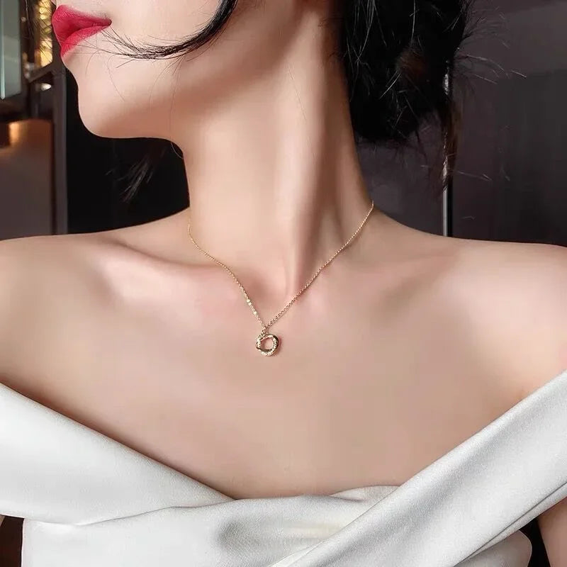 INFINITY - Gold-Plated Crystal Knot Pendant Necklace